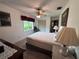 Cozy bedroom with a comfortable bed and window view at 1871 Riveredge Dr, Astor, FL 32102