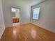 Empty bedroom with wood-look flooring and an ensuite bathroom at 1072 Ceasars Ct, Mount Dora, FL 32757