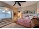 Charming bedroom with pink bedding and built-in window seat at 111 Fleming Ave, Port Orange, FL 32127