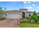 Two-car garage home with brick paver driveway at 259 Cherokee Hill Ct, Deland, FL 32724