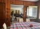 Dining room with wood paneling and view into living room at 1415 Talton Ave, Deland, FL 32720