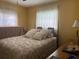 Spacious bedroom with a floral comforter and plenty of pillows at 1415 Talton Ave, Deland, FL 32720