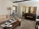 Living room featuring a piano, comfy seating, and large windows at 1415 Talton Ave, Deland, FL 32720