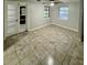 Living room with tile floor and french doors to entry at 133 Debary Dr, Debary, FL 32713