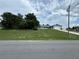 Ranch-style home with a long driveway and mature landscaping at 1757 W Acadian Dr, Deltona, FL 32725