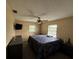 Bright bedroom with a king-size bed and plenty of natural light at 1757 W Acadian Dr, Deltona, FL 32725