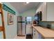 Small galley kitchen with stainless steel appliances and butcher block countertops at 111 Fleming Ave, Port Orange, FL 32127