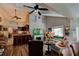 Open living room with hardwood floors, fireplace, and ample natural light at 111 Fleming Ave, Port Orange, FL 32127