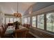 Bright dining room with glass table, wicker chairs, and plantation shutters at 111 Fleming Ave, Port Orange, FL 32127