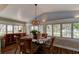 Bright dining room with glass table, wicker chairs, and plantation shutters at 111 Fleming Ave, Port Orange, FL 32127