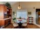 Bright dining area with a round glass table and wicker chairs at 111 Fleming Ave, Port Orange, FL 32127