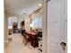 Home office features built-in desk, view into Gathering room and kitchen at 111 Fleming Ave, Port Orange, FL 32127