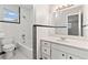 Clean bathroom with white vanity and black and white tile at 22 Morning Star Ave, Ormond Beach, FL 32176