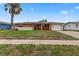 Single story home with brick facade and lawn at 22 Morning Star Ave, Ormond Beach, FL 32176