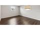 Spacious bedroom with dark wood laminate flooring at 22 Morning Star Ave, Ormond Beach, FL 32176