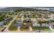 Aerial perspective of a beachfront community, featuring numerous houses and lush greenery at 22 Morning Star Ave, Ormond Beach, FL 32176