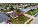 An aerial shot of a single Gathering home with a yard and driveway at 22 Morning Star Ave, Ormond Beach, FL 32176