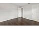 Simple bedroom with dark laminate floors and neutral walls at 22 Morning Star Ave, Ormond Beach, FL 32176