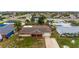 Aerial view of a single-Gathering house with a spacious yard and driveway at 22 Morning Star Ave, Ormond Beach, FL 32176