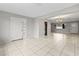 Open concept living area with tile floors and access to the kitchen at 22 Morning Star Ave, Ormond Beach, FL 32176