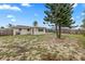 Spacious backyard with a screened patio at 22 Morning Star Ave, Ormond Beach, FL 32176