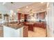 Updated kitchen featuring granite countertops and wood cabinetry at 3703 S Atlantic Ave # 501, Daytona Beach Shores, FL 32118