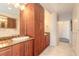 Bathroom with double vanity and extensive cabinetry at 3703 S Atlantic Ave # 501, Daytona Beach Shores, FL 32118