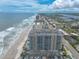 Coastal aerial view showing oceanfront building at 3703 S Atlantic Ave # 501, Daytona Beach Shores, FL 32118