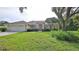 Single-story home with attractive landscaping and a large yard at 3709 Donegal Cir, Ormond Beach, FL 32174