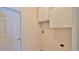 Convenient laundry room with washer and dryer hookups and extra storage at 3709 Donegal Cir, Ormond Beach, FL 32174