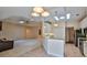 Open kitchen with breakfast bar and access to living areas at 3709 Donegal Cir, Ormond Beach, FL 32174