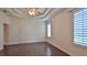 Bright bedroom featuring hardwood floors, plantation shutters, and a walk-in closet at 3709 Donegal Cir, Ormond Beach, FL 32174