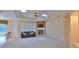 Relaxing living room featuring a fireplace and a large window at 3709 Donegal Cir, Ormond Beach, FL 32174