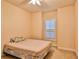 Spacious bedroom with a large window and ceiling fan at 3709 Donegal Cir, Ormond Beach, FL 32174