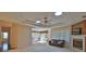 Spacious living room with fireplace and views to kitchen at 3709 Donegal Cir, Ormond Beach, FL 32174