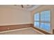 Spacious bedroom with neutral walls and window shutters at 3709 Donegal Cir, Ormond Beach, FL 32174