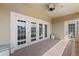 Private balcony with access doors and ceiling fan at 424 Luna Bella Ln # 428, New Smyrna Beach, FL 32168