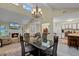 Bright dining room with chandelier and views to living room at 980 Bluebird Ter, Deltona, FL 32725