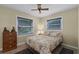 Comfortable bedroom with a floral comforter and ample closet space at 980 Bluebird Ter, Deltona, FL 32725