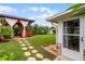Spacious backyard with hot tub, gazebo, and stone path at 980 Bluebird Ter, Deltona, FL 32725