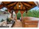 Relaxing gazebo with hot tub and comfortable seating at 980 Bluebird Ter, Deltona, FL 32725