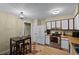 Kitchen boasts stainless steel appliances and an adjacent breakfast nook at 980 Bluebird Ter, Deltona, FL 32725