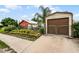 Landscaped backyard with storage shed and charming cottage at 980 Bluebird Ter, Deltona, FL 32725