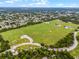 Aerial view of a community with lush green athletic fields at 980 Bluebird Ter, Deltona, FL 32725