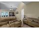 Open living room with vaulted ceilings and comfortable seating at 980 Bluebird Ter, Deltona, FL 32725