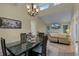 Elegant dining room with chandelier and access to kitchen at 980 Bluebird Ter, Deltona, FL 32725