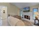 Relaxing living room with fireplace and large TV at 980 Bluebird Ter, Deltona, FL 32725