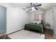 Bedroom with green metal bed frame and pink curtains at 2100 Brian Ave, South Daytona, FL 32119