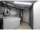 Laundry room with washer, dryer, and shelving for storage at 2100 Brian Ave, South Daytona, FL 32119