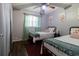Guest bedroom with two twin beds and light green curtains at 2100 Brian Ave, South Daytona, FL 32119